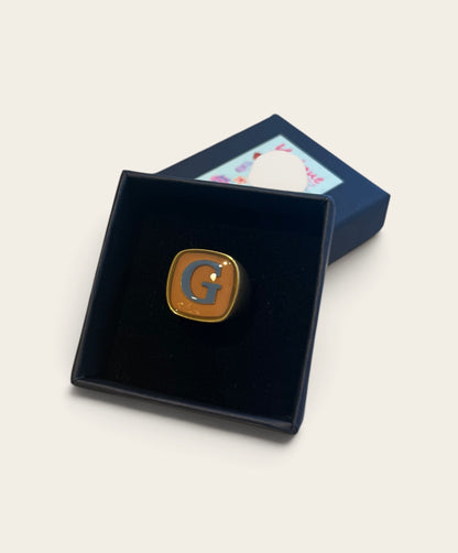 Anello con iniziale UNIQUE